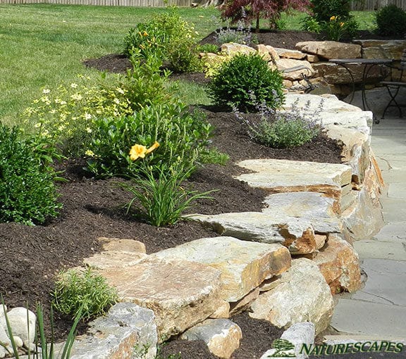 Retaining Wall with Boulders and Small Garden